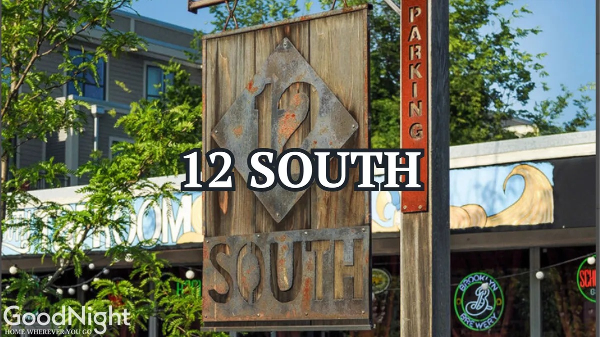 A vibrant exterior scene with visible retail signage, lush greenery, and nearby shops. People can be seen enjoying outdoor dining and exploring local boutiques, contributing to the inviting and lively neighborhood feel.
